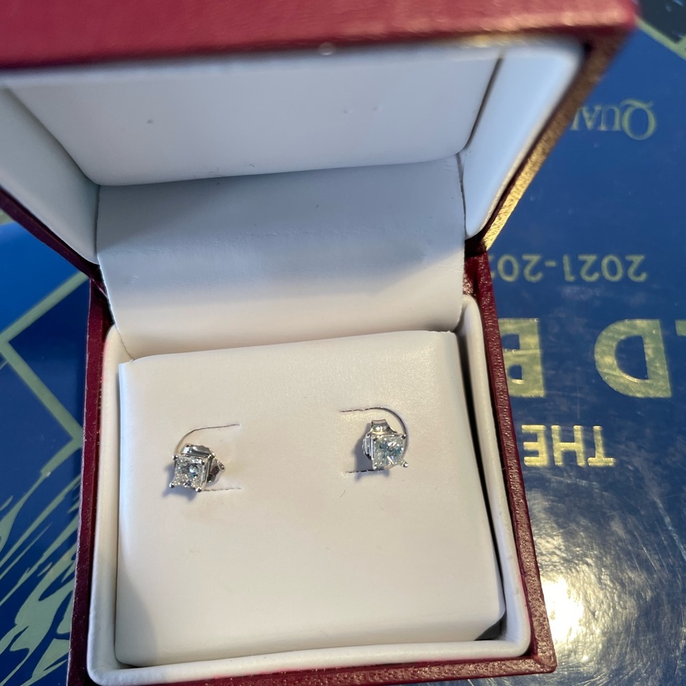 Helzberg Diamonds. 1/4 carat each. White gold. Never worn.